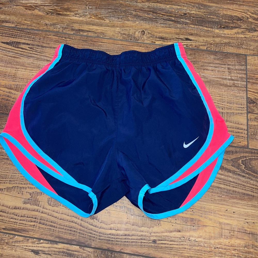 Navy and pink Nike running shorts